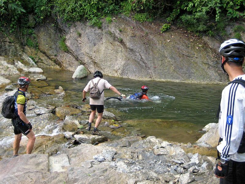 2006-10-30-08-12-13_268 Thanh riding into waterfall, Suphi to Viet Lam 1.JPG